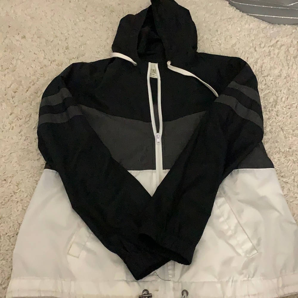 black, grey, white windbreaker
